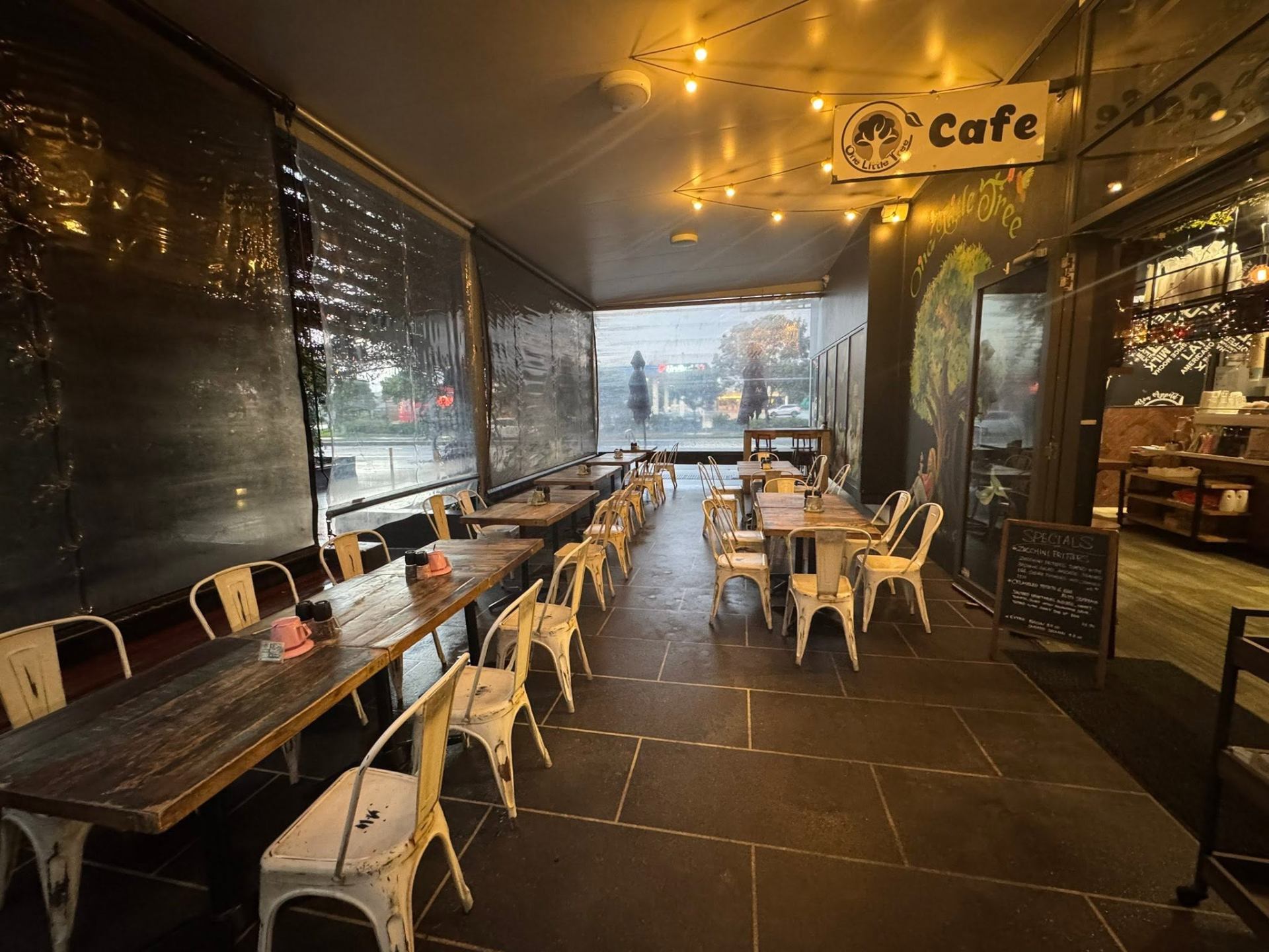 Warm, plant filled interior of One Little Tree Cafe in Pimpama